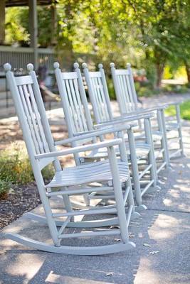 A Row of Four Rocking Chairs image