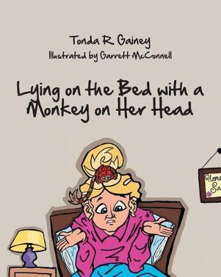 Lying on the Bed with a Monkey on Her Head image