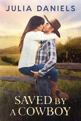Saved by a Cowboy by Julia Daniels image