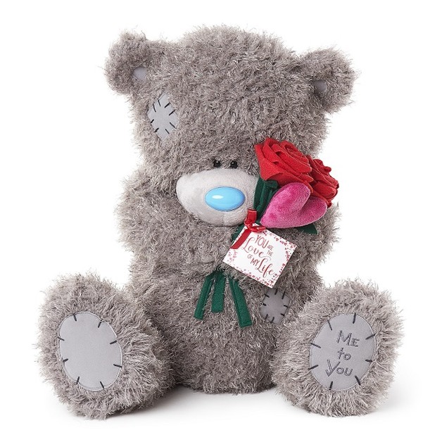 large tatty teddy bear