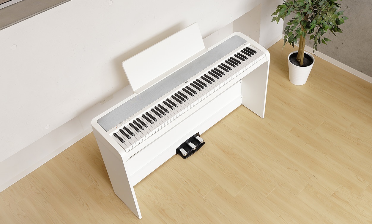 B2 Digital Piano White with triple pedal unit and stand at